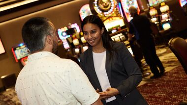 Casino host interacting with a guest.