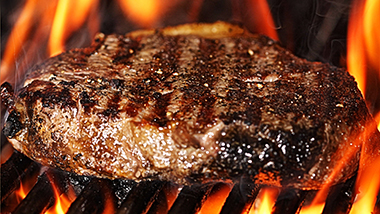 Steak over a flame