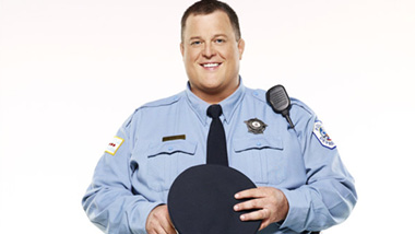 Billy Gardell in a Police Uniform.