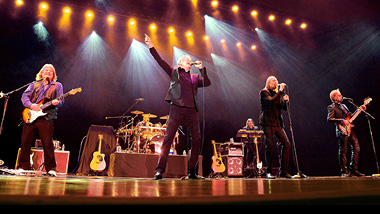 The band Three Dog Night performing on stage.