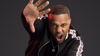 Bow Wow in jacket with black background