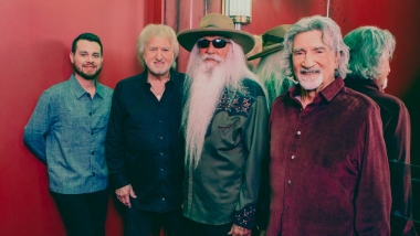 Oak Ridge Boys with red background