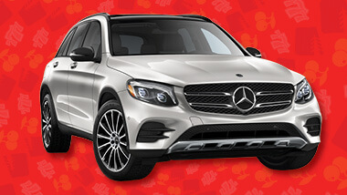 A gray Mercedes-Benz on a red background.