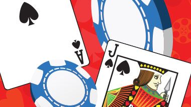 Ace of Spades and Jack of Spades cards lie next to blue and white chips on a red background.