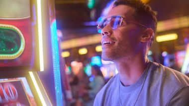 Man playing a shot machine